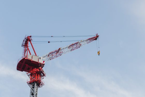 A crane standing in the sky
